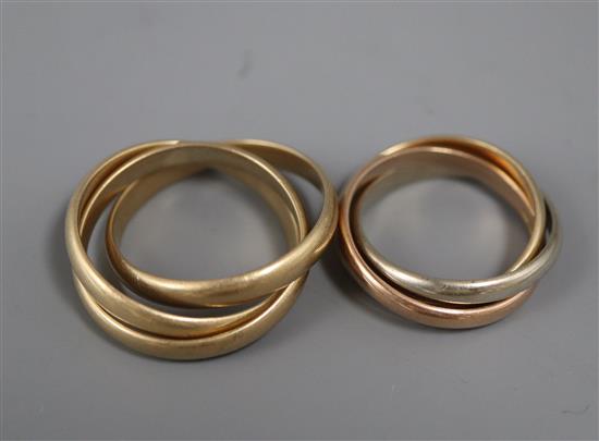 A 9ct three-colour gold Russian wedding ring and another similar 9ct gold ring.